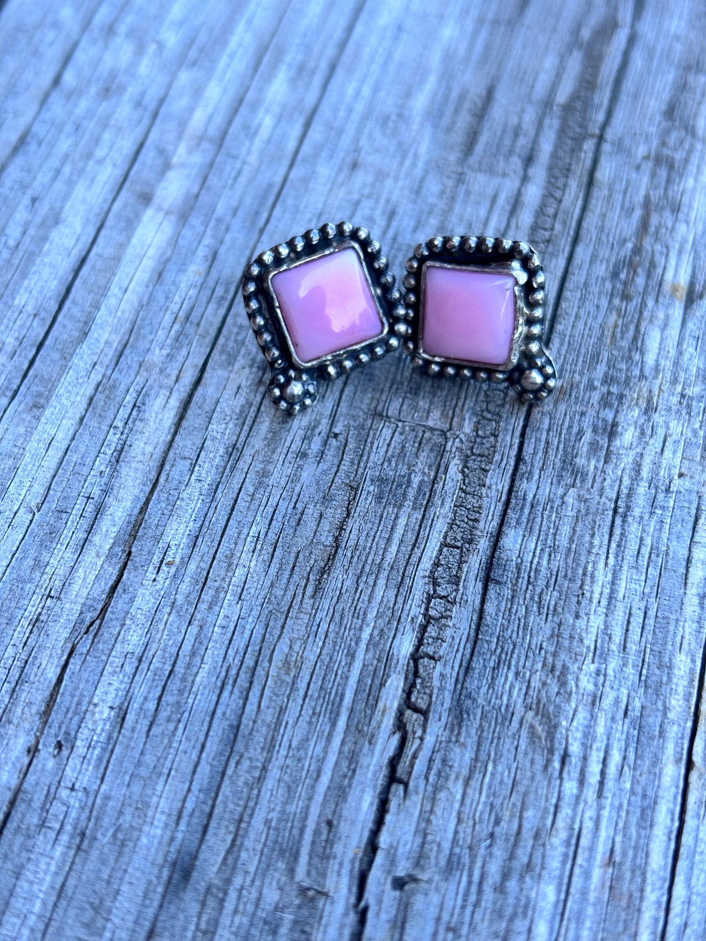 Pink conch studs