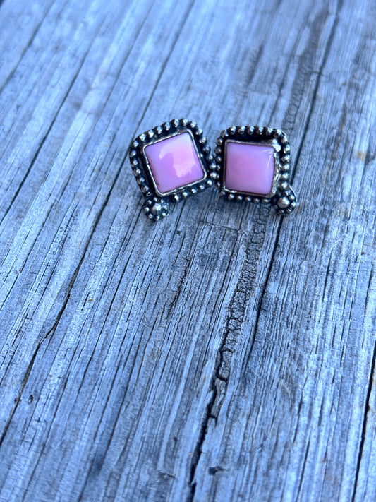 Pink conch studs