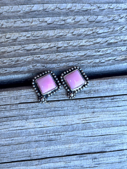 Pink conch studs
