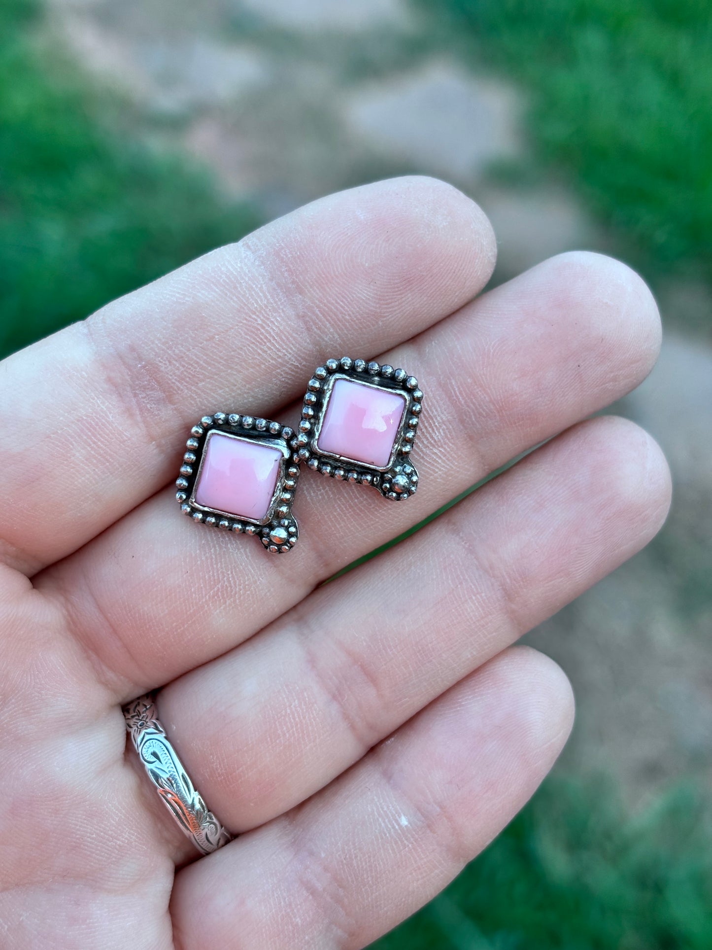 Pink conch studs